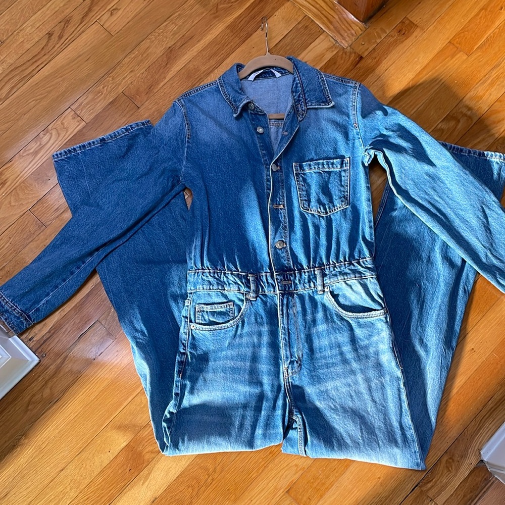 Denim jumpsuit from Zara. Long sleeve. Button and zip front. Size M.